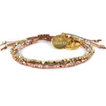 Product photography of a multi-strand bracelet featuring gold silver and rose gold faceted beads with a round "LOVE PROJECT" charm and a heart charm on an adjustable brown cord against a white background